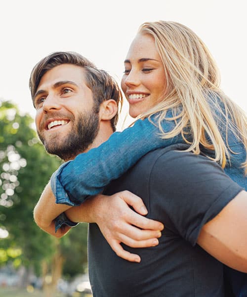 Adults smiling at Orthodontics of West Nyack in West Nyack, NY